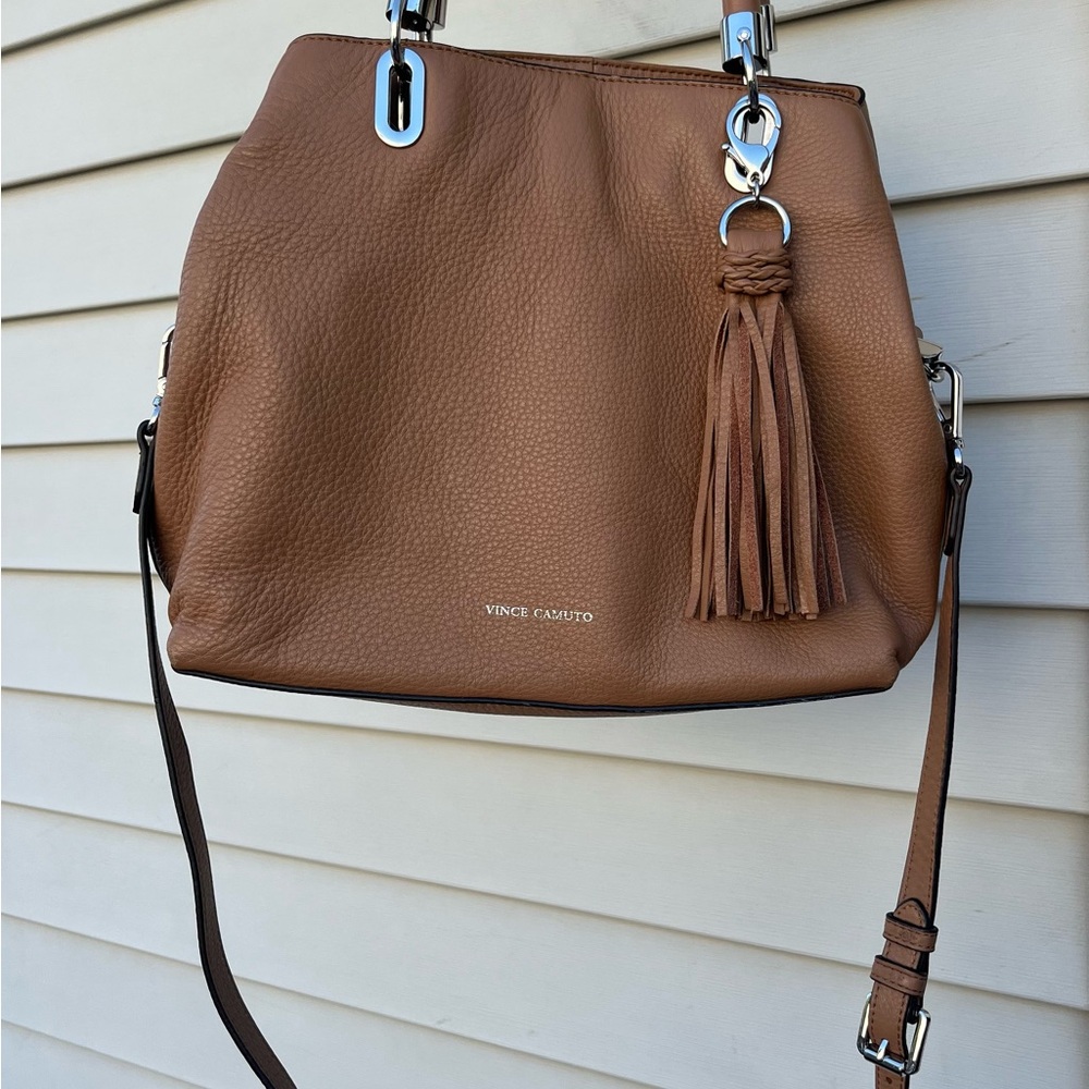 Vince Camuto tan leather crossbody bag.